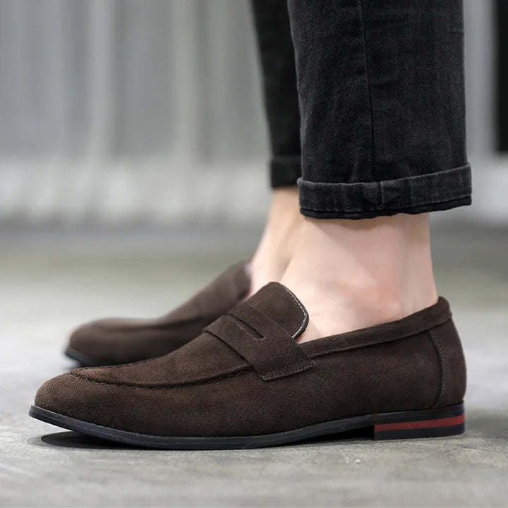 Side view of classic men's slip-on loafers, durable and comfortable footwear for any occasion.