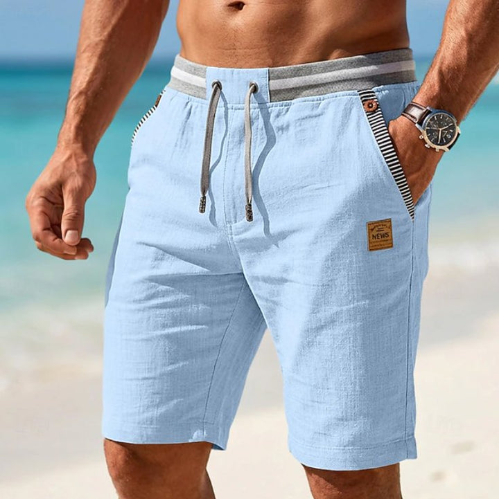 Stylish men's black drawstring shorts, ideal for beach, vacation, or warm weather casual fashion.
