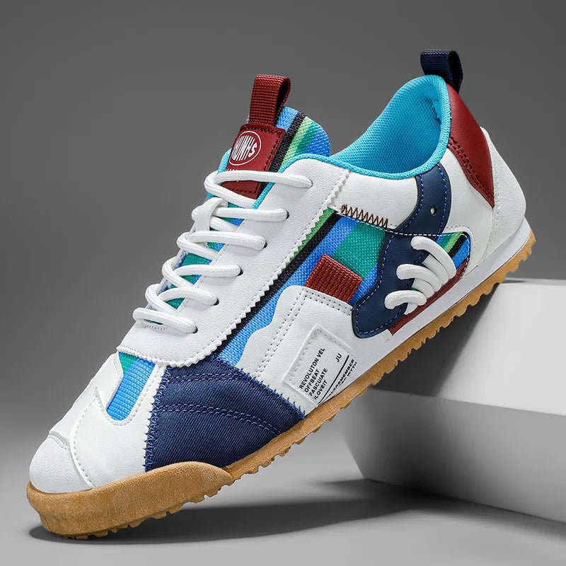 Men's blue, gray & yellow patchwork utility sneakers for multi-terrain trail & street wear. Durable & active.