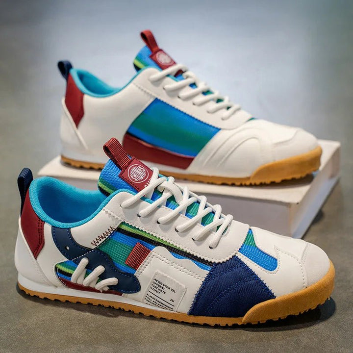 Men's fashion blue, gray, yellow patchwork sneakers. Durable multi-terrain utility shoes for trail & street.