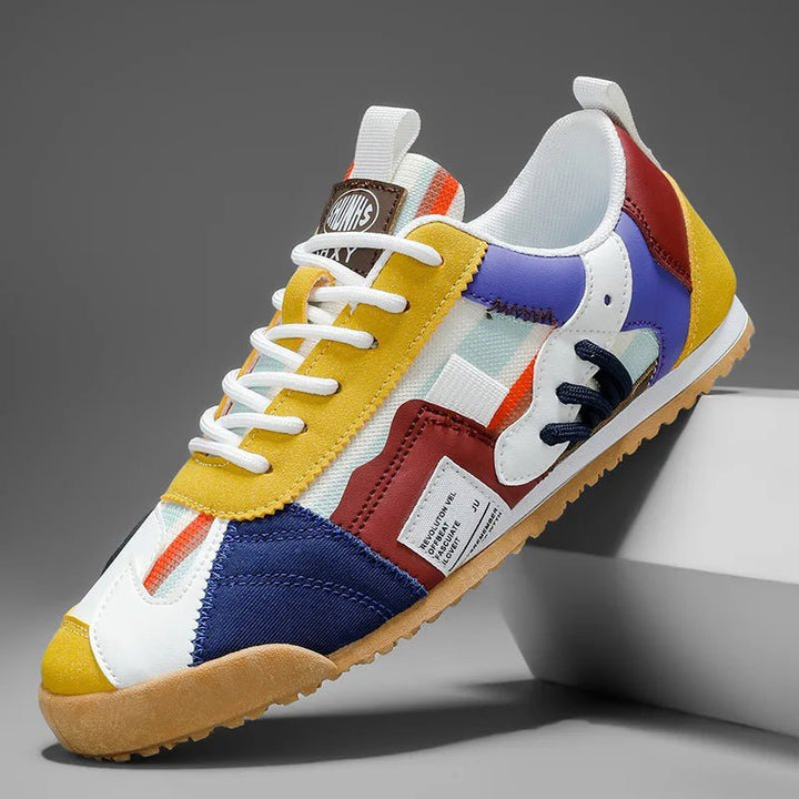 Durable men's utility sneakers with patchwork design in blue, gray & yellow. Perfect for trail & street.