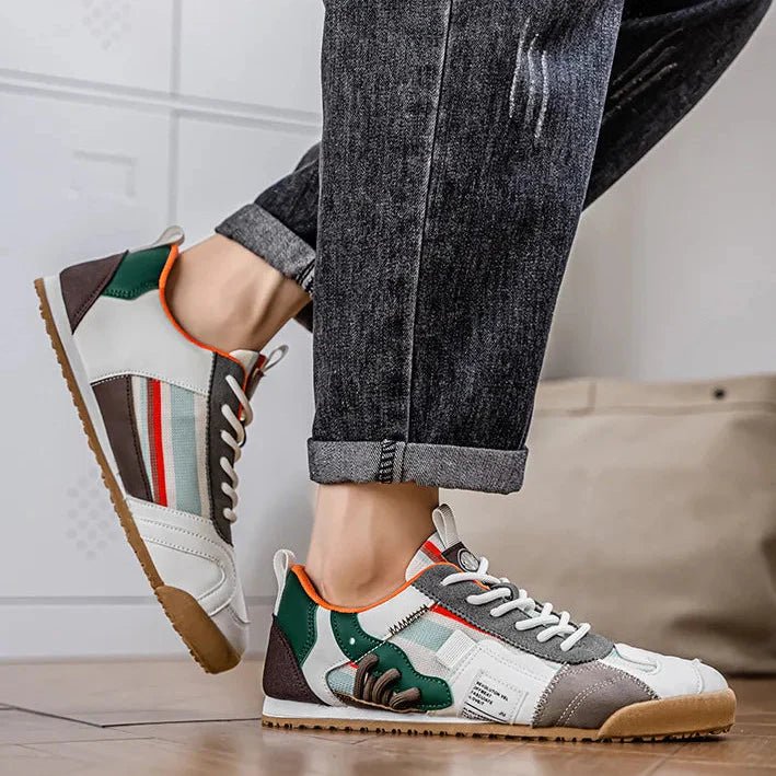 Durable men's patchwork utility sneakers. Multi-terrain blue, gray, yellow footwear for active men's fashion.