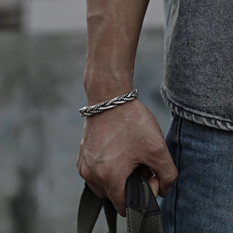 Men's braided sterling silver cuff bracelet, adjustable open cuff for a stylish statement piece.