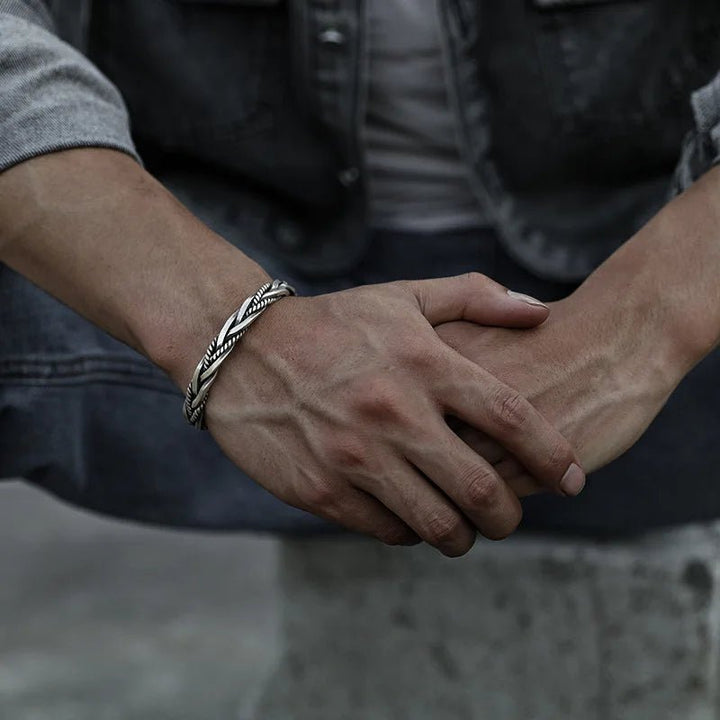 Oxidized sterling silver braided men's cuff bracelet, a rugged yet elegant men's fashion accessory.