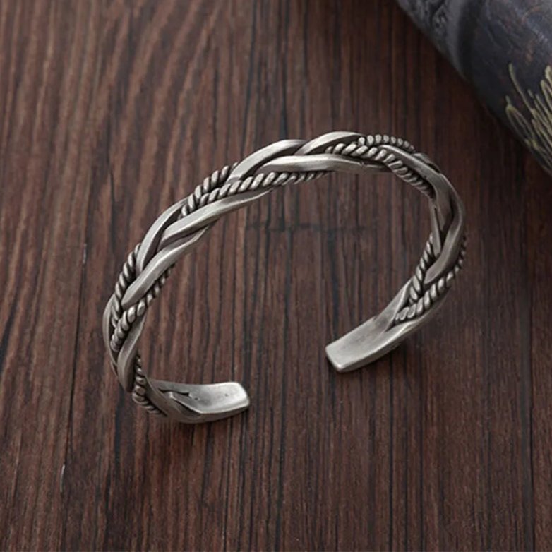 Classic men's sterling silver braided cuff bracelet, sleek silver jewelry with an open cuff design.