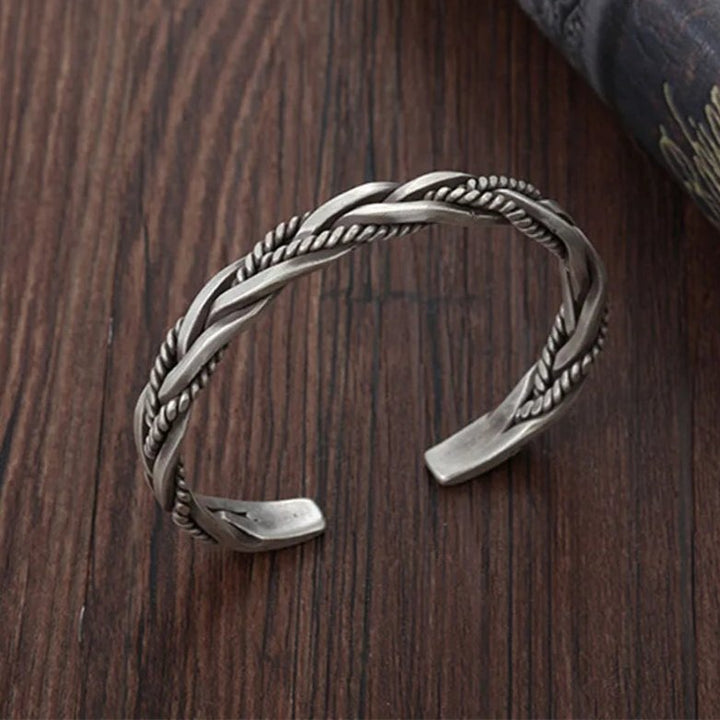 Classic men's sterling silver braided cuff bracelet, sleek silver jewelry with an open cuff design.