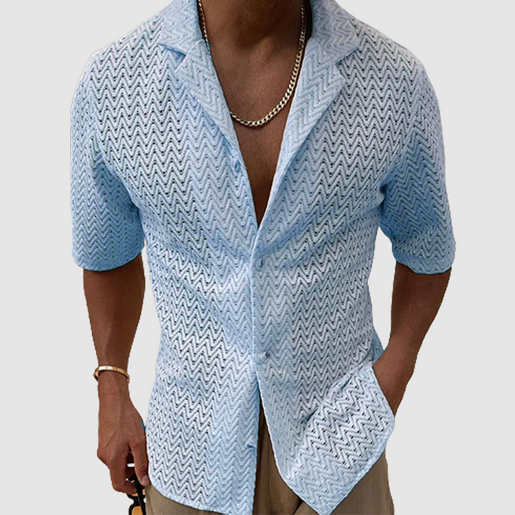 Close-up of a men's open-weave textured leisure shirt, highlighting the breathable fabric for summer comfort.