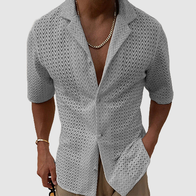 Versatile men's breathable open-weave leisure shirt. Short sleeve, relaxed fit, and lightweight for summer fashion.