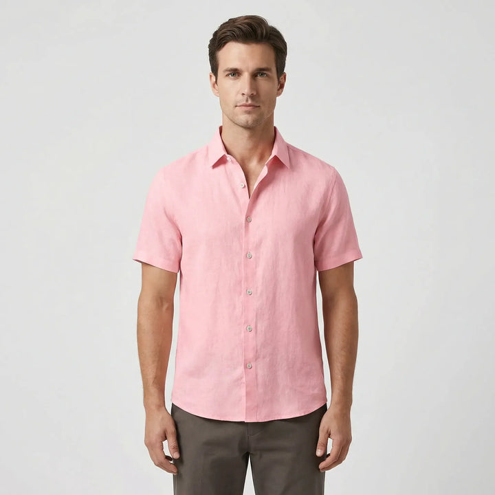 Stylish men's casual short sleeve button-up shirt with a relaxed fit for summer wear.