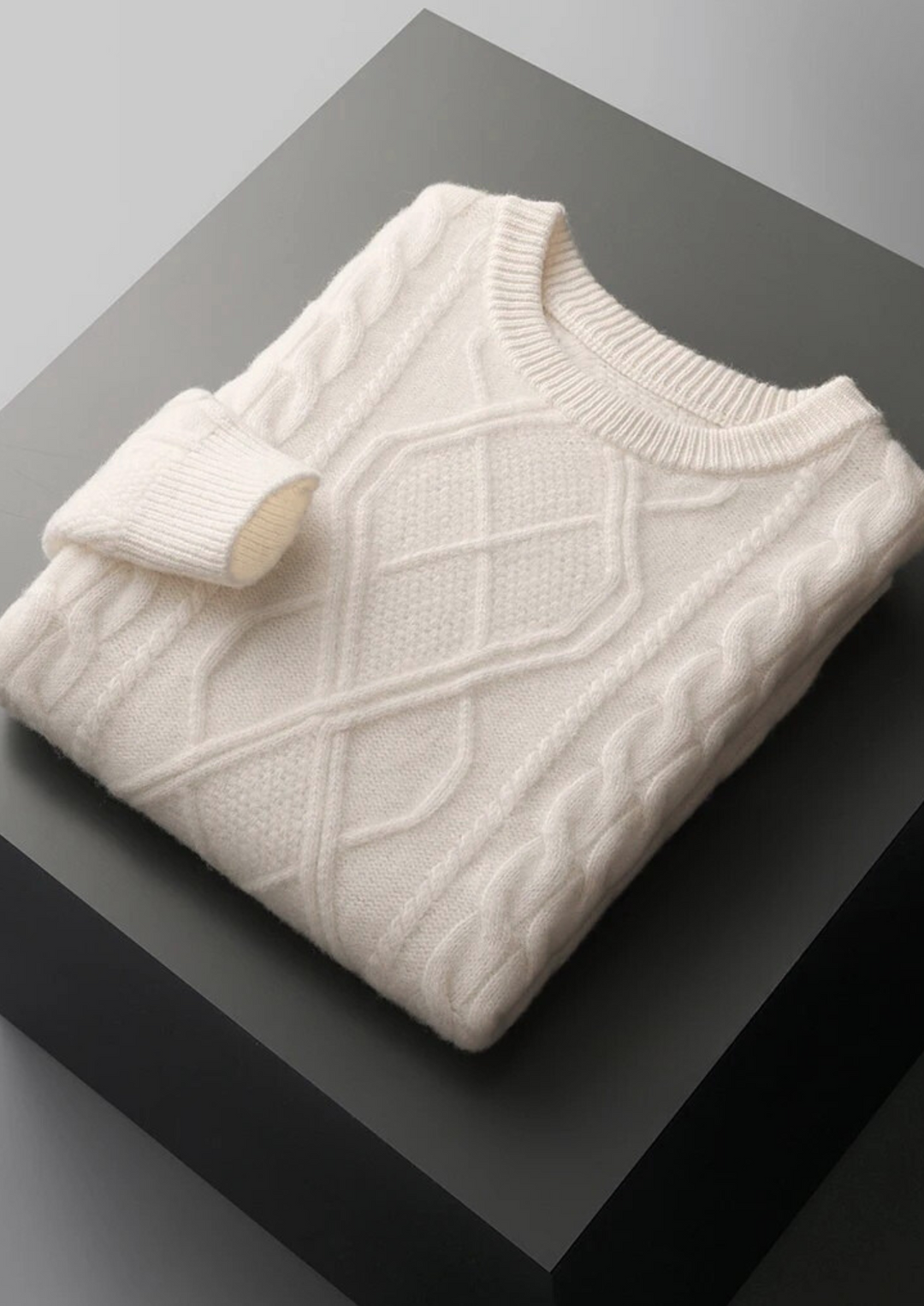 Classic men's cable knit crew neck sweater. An essential winter layer for comfort and style.