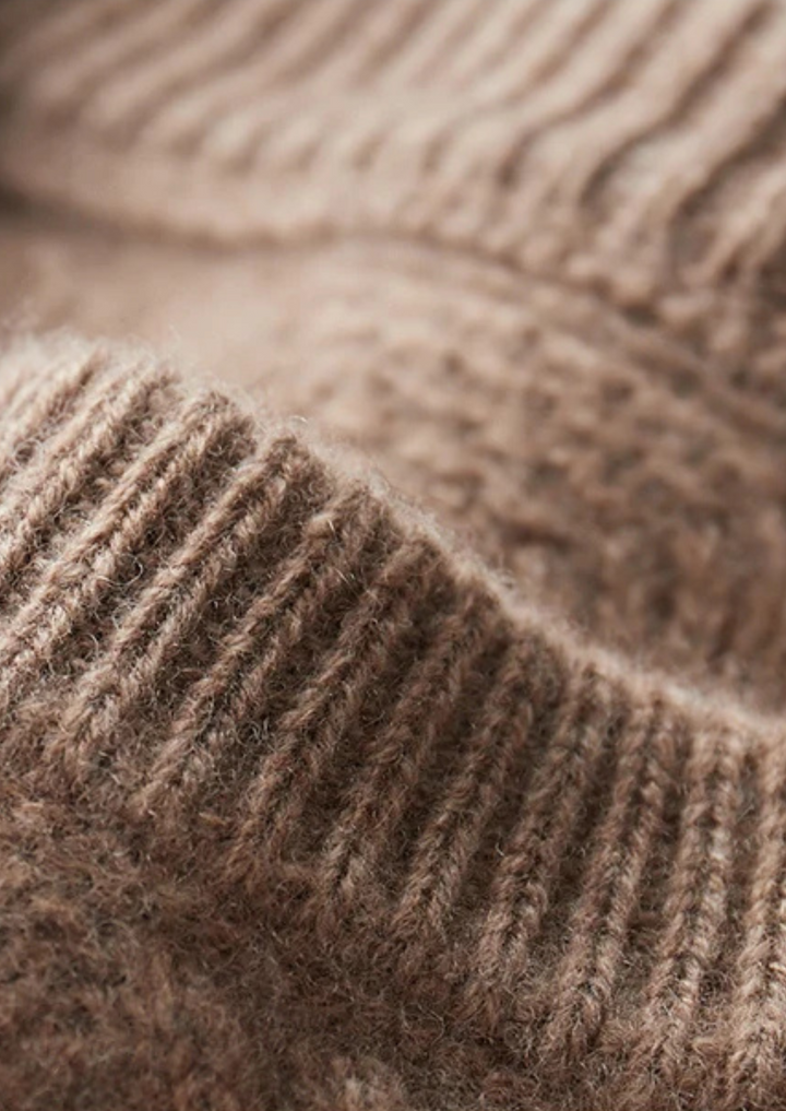Men's classic cable knit crew neck sweater, offering timeless style and winter warmth.