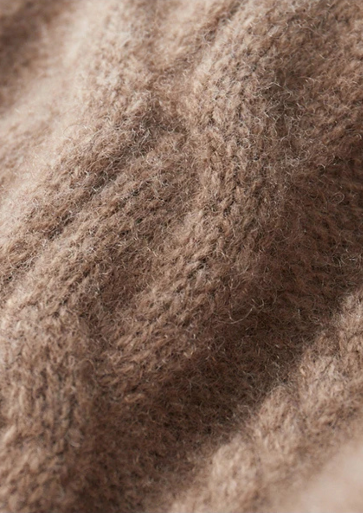 Durable men's cable knit crew neck sweater, a versatile piece for casual winter fashion.