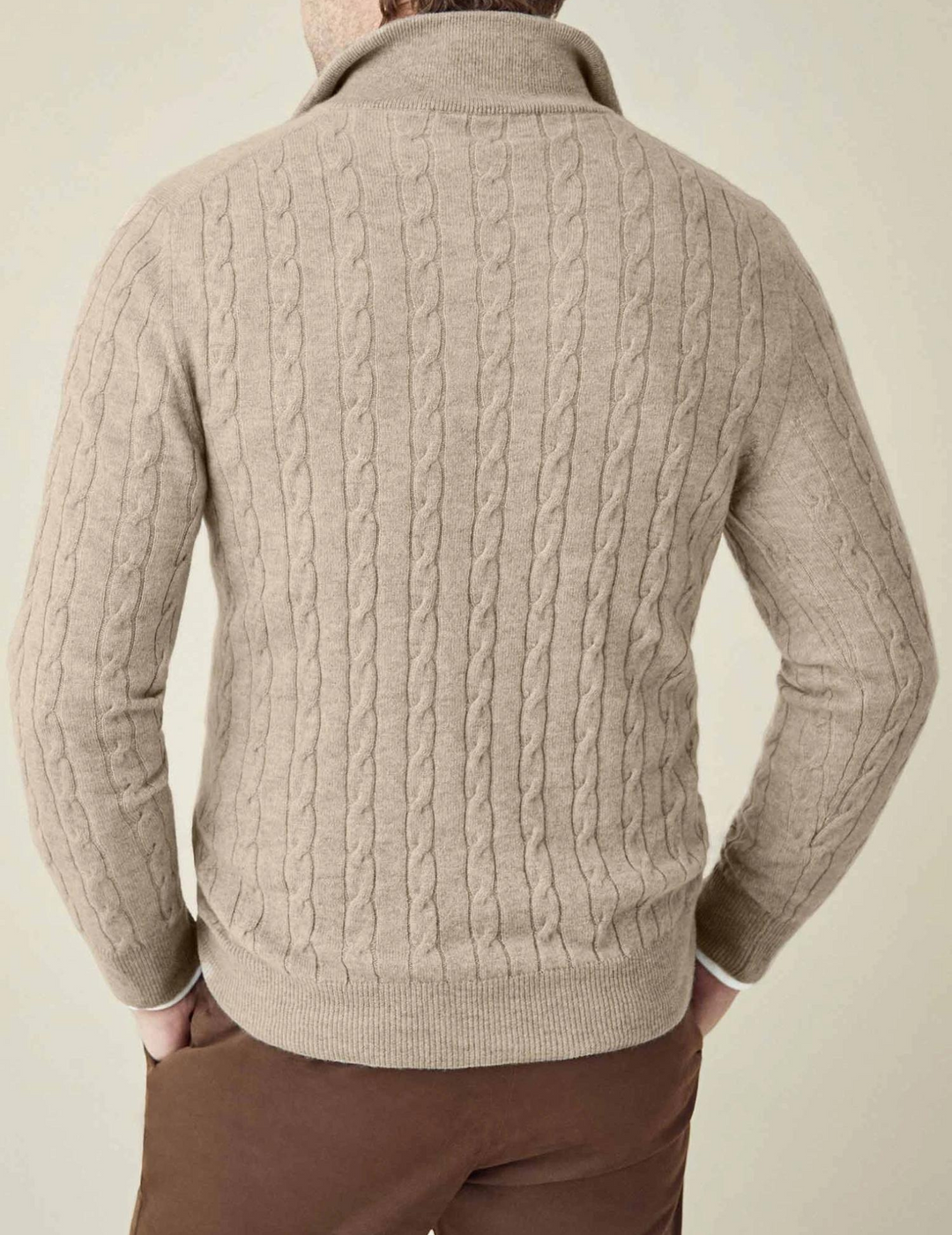 Relaxed men's cable-knit quarter-zip sweater, exuding timeless style and warmth.