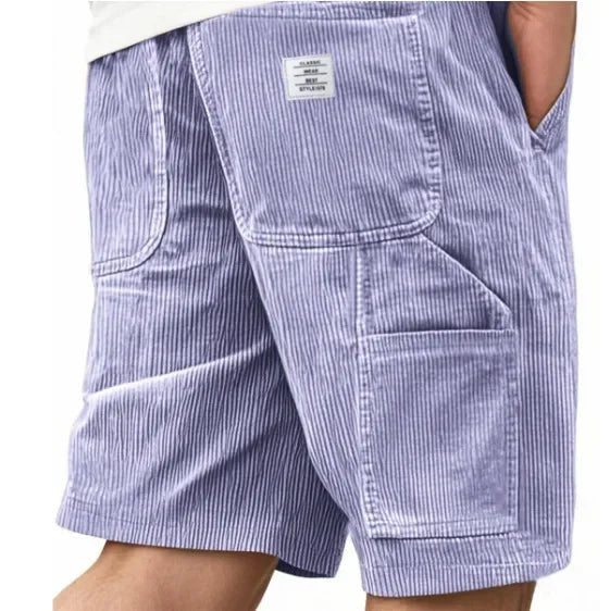 Stylish men's streetwear cargo shorts, relaxed fit, providing ample storage & casual comfort for urban exploration.