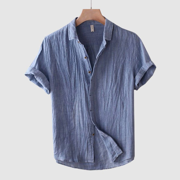 Lightweight men's short sleeve crinkle texture button-down shirt, relaxed fit, ideal for summer style.