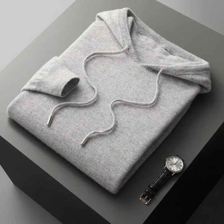 Men's long sleeve knit hoodie sweater featuring a practical drawstring hood. Ideal comfortable pullover for casual style.