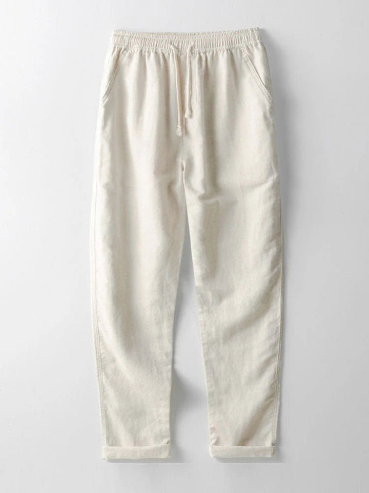 Men's comfortable two-piece set: casual shirt & pants with rolled cuffs. Relaxed for summer.