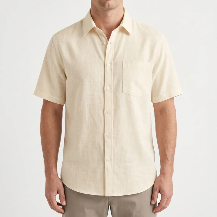Relaxed fit men's button-up shirt with short sleeves, designed for warm weather comfort & casual style.