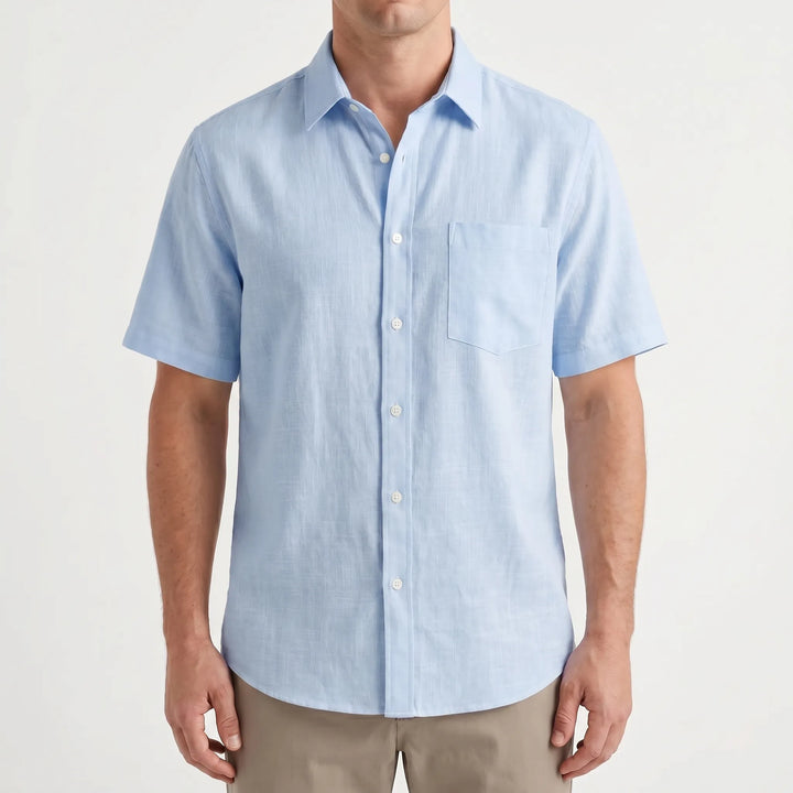 Stylish men's short-sleeve button-up shirt for casual outings, offering comfort & a relaxed fit for warm days.