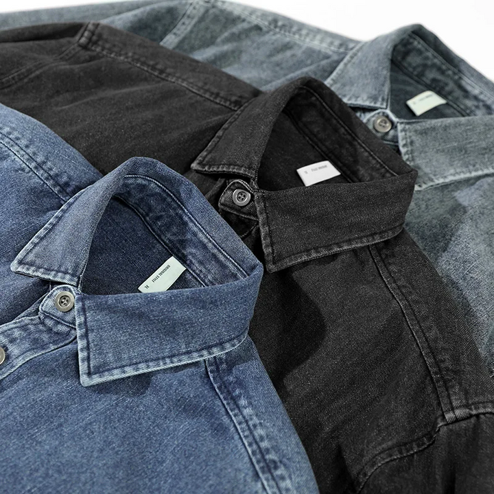 Relaxed fit men's casual washed denim button-up shirt with long sleeves, offering comfortable and versatile style.