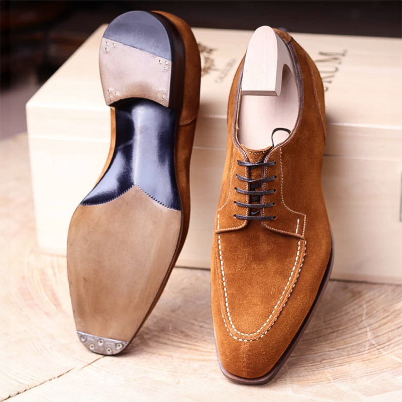 Men's classic Oxford dress shoes styled with business attire. Perfect for formal wear, offering comfort & elegance.