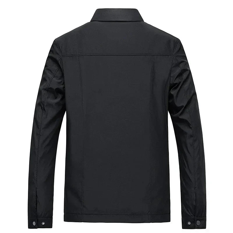 Stylish men's zip-up jacket revealing a distinctive checked lining, ideal for casual and smart-casual looks.