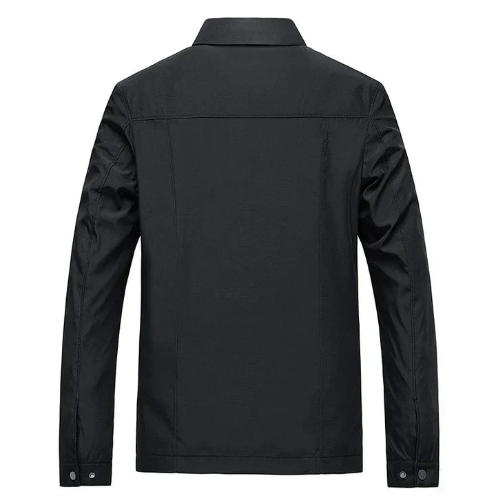 Stylish men's zip-up jacket revealing a distinctive checked lining, ideal for casual and smart-casual looks.