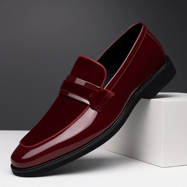 Sophisticated men's black penny loafers; classic slip-on dress shoes for office, events, and smart casual style.