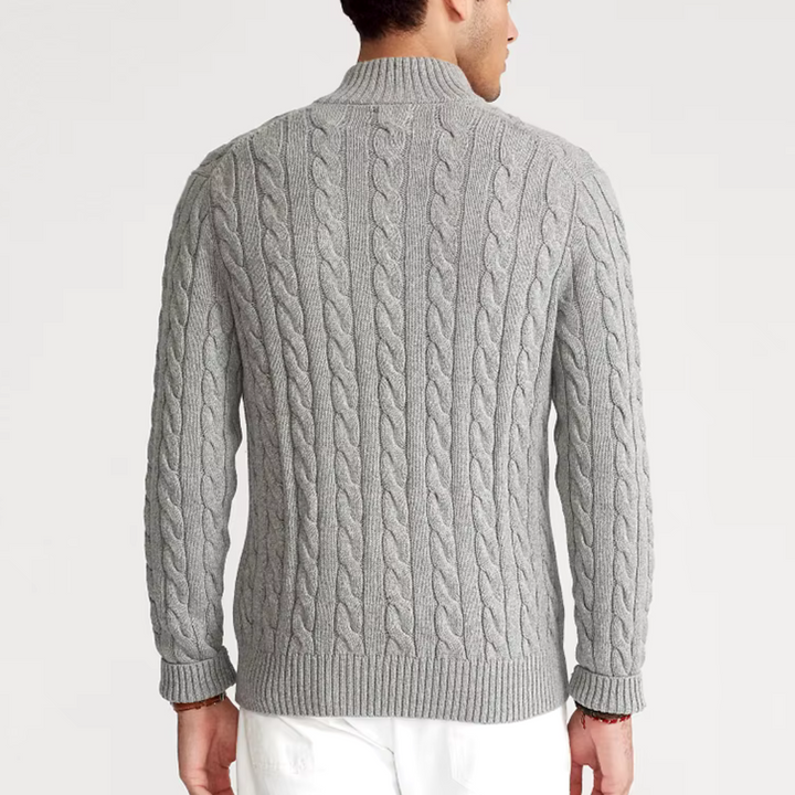 Stylish men's cable knit pullover with a practical half-zip closure. Essential cozy knitwear.