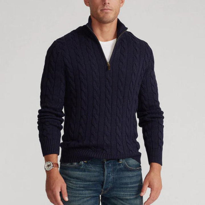 Man modeling a cozy men's half-zip cable knit sweater. A classic and stylish winter pullover.