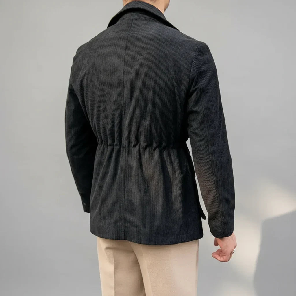 Fashionable men's herringbone blazer featuring prominent gold-tone accents, perfect for formal events or office attire.