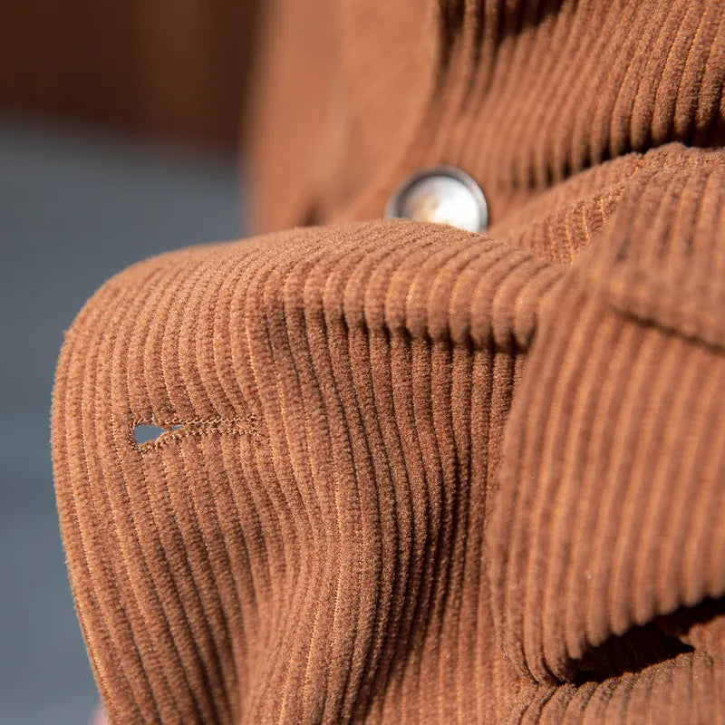 Elegant men's tailored herringbone blazer, ideal for versatile styling from business casual to more formal occasions.
