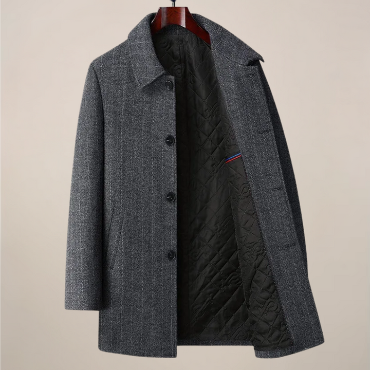 Close-up of men's herringbone car coat fabric texture & classic point collar. Ideal for gentlemen.