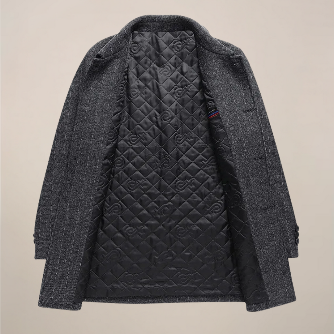 Stylish man wearing a grey herringbone car coat, showcasing its classic fit & elegant design. Fall fashion.