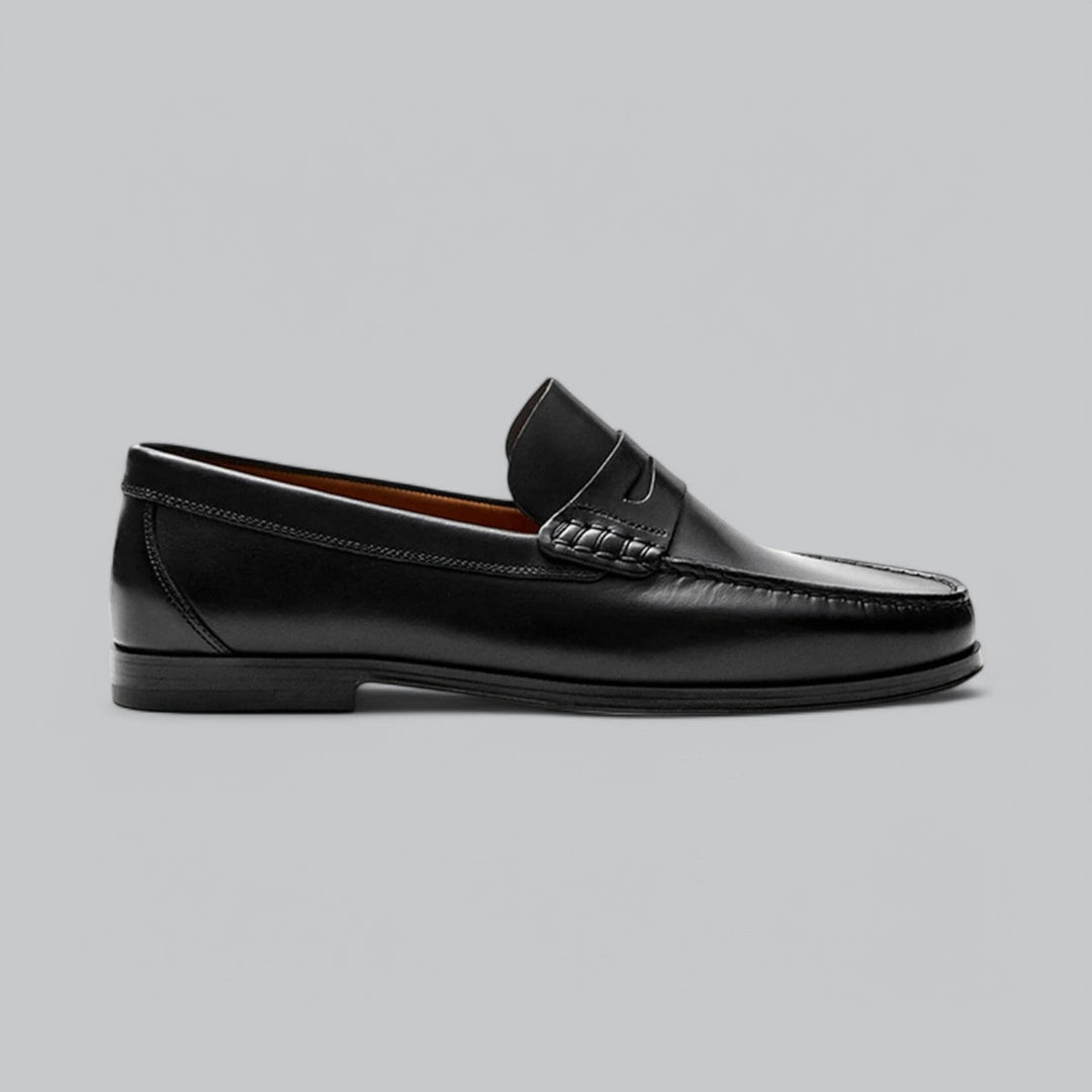 Men's polished leather penny loafers, sleek slip-on design with a durable sole, perfect for refined style.