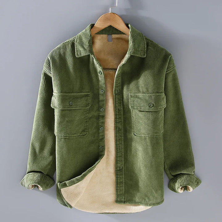 Stylish man wearing a classic ribbed corduroy jacket, perfect for casual fall & winter outings. Versatile men's outerwear.