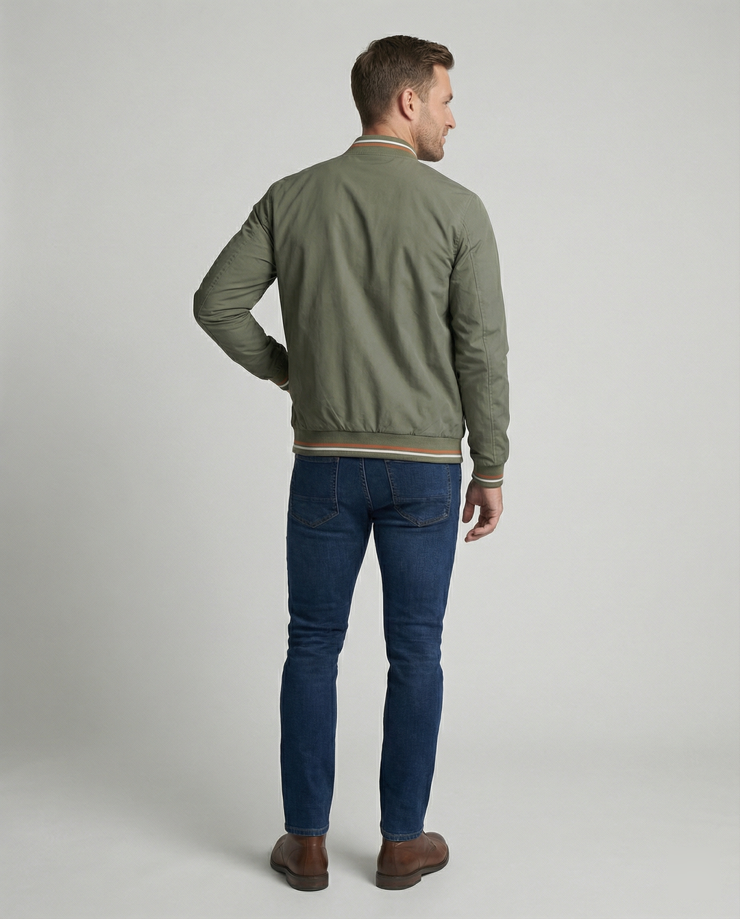 Versatile men's bomber jacket for fall and spring fashion, featuring classic ribbed trim and zipper.