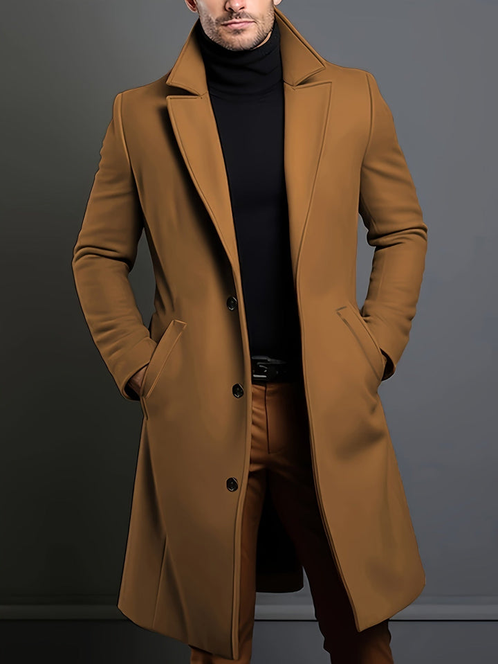 Sleek men's long single-breasted lapel overcoat by Russell. Classic winter coat for an elegant, modern silhouette.