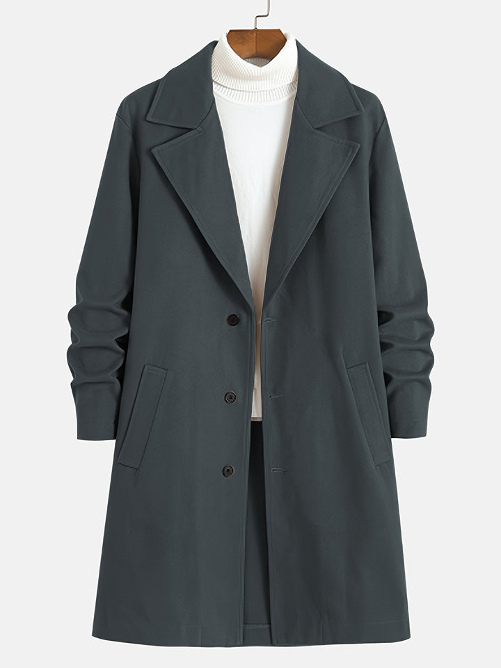 Man wearing a classic Russell single-breasted lapel overcoat. Stylish long winter coat, perfect for men's business fashion.