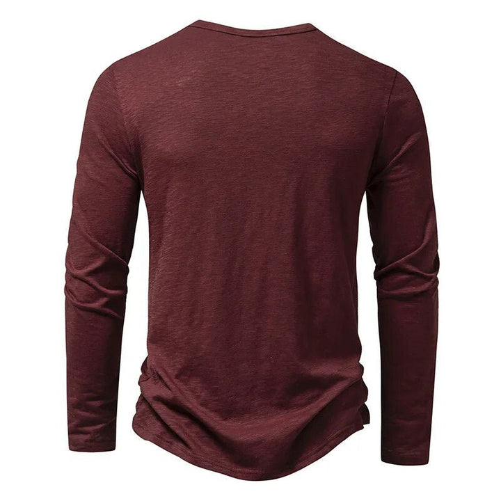 Army green men's slim fit long sleeve Henley, a go-to top for casual and everyday fashion.