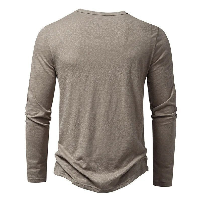White men's classic slim fit Henley shirt with button placket, an essential long sleeve top.