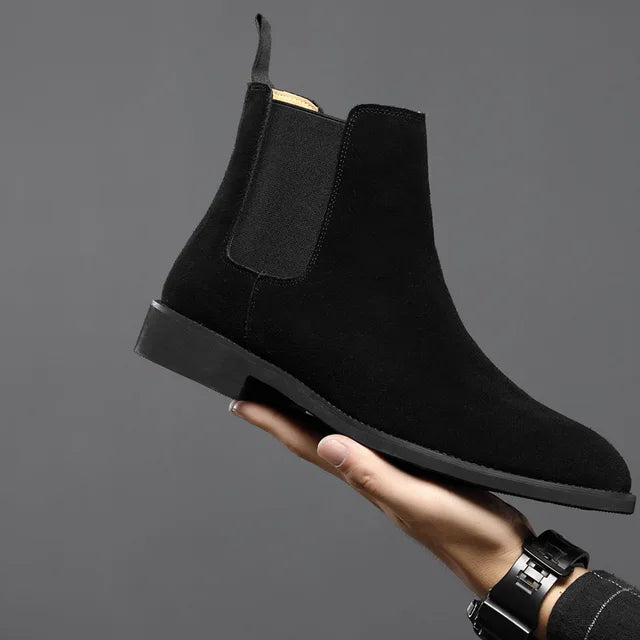 Close-up of men's casual slip-on Chelsea boots, showcasing their comfortable and sleek design.