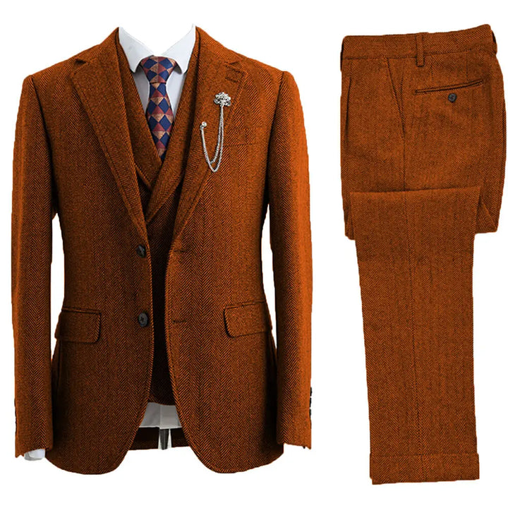 Detail of the peak lapel and pocket of a men's classic herringbone formal suit, showcasing tailored craftsmanship.