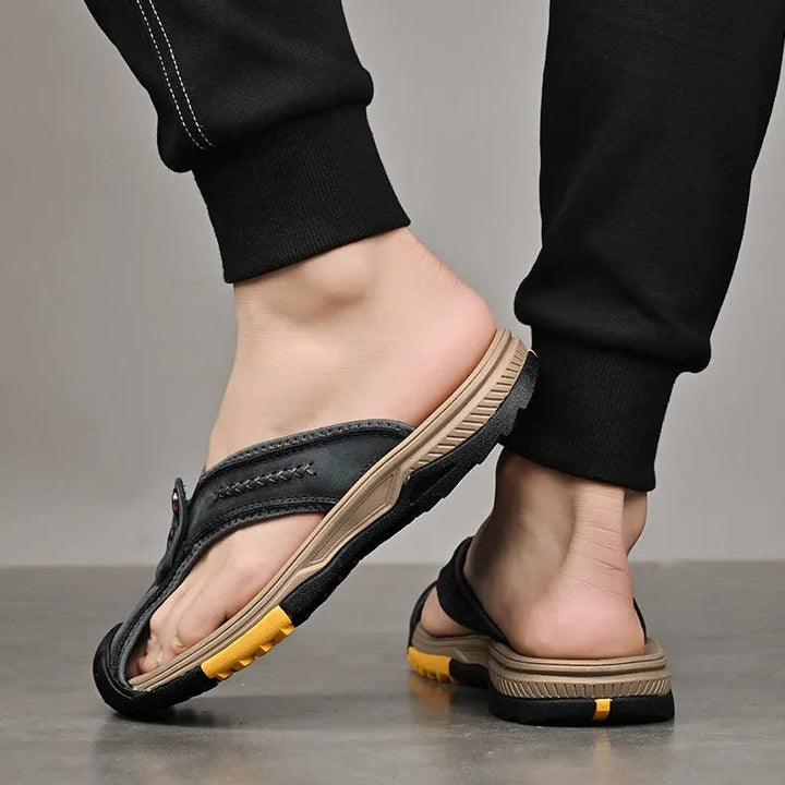 Protective closed toe men's sandals, water resistant & non-slip, ensuring safety on varied terrain.