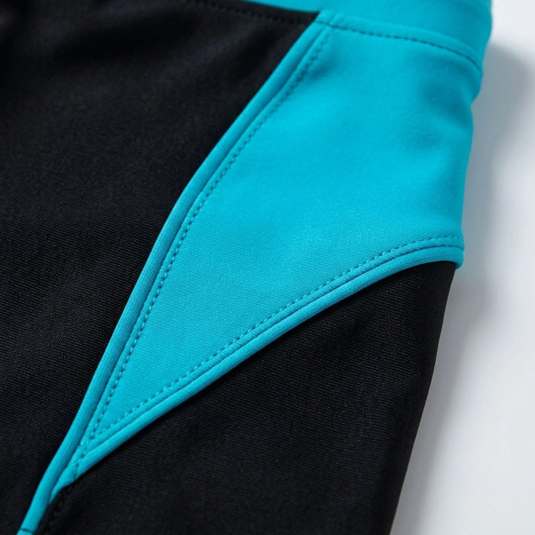 Athletic men's color block swim boxers with secure fit, ideal for swimming & beachwear.