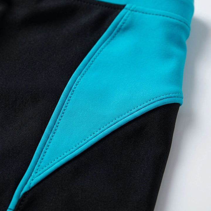 Athletic men's color block swim boxers with secure fit, ideal for swimming & beachwear.
