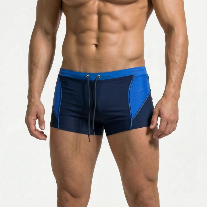 Men's summer vacation color block swim boxers. Athletic and comfortable beach trunks.