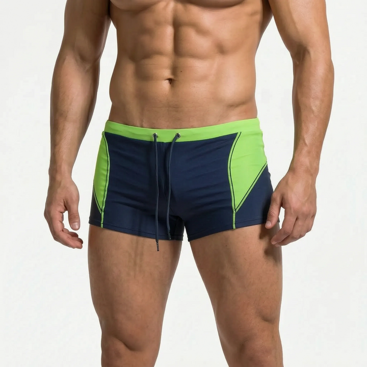 Resort wear men's color block swim trunks. Stylish, quick-dry boxer shorts for poolside.