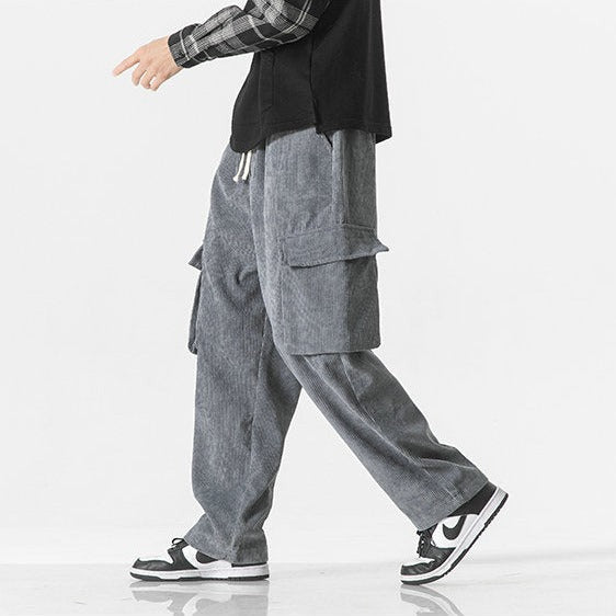 Black men's cargo pants, relaxed fit, practical utility pockets, easy-to-adjust drawstring.