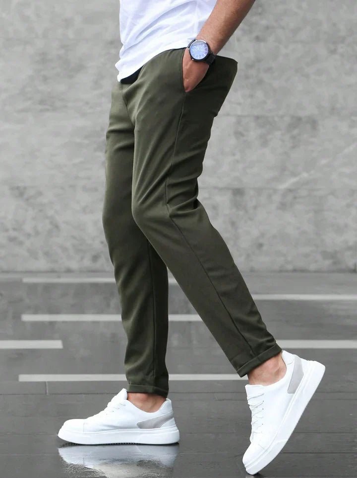 Men's drawstring chino pants paired with a casual top, creating a versatile everyday look.